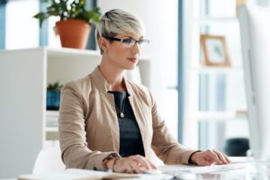 Virtual support specialist working at a modern desk, illustrating managed virtual support for growing businesses