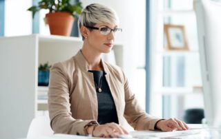 Virtual support specialist working at a modern desk, illustrating managed virtual support for growing businesses