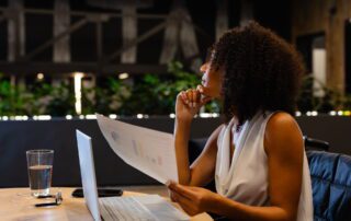 Business leader evaluating strategy vs instructions virtual assistant delegation approach while reviewing documents