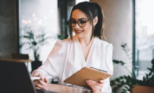 Wedding coordinator reviewing virtual support options for strategic versus implementation services