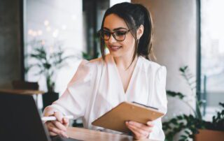 Wedding coordinator reviewing virtual support options for strategic versus implementation services