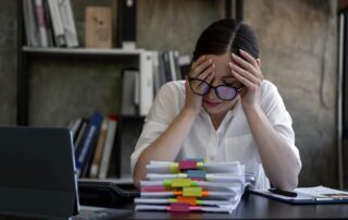 Overwhelmed business owner stressed by full-time virtual assistant management burden