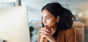 Professional business leader in thoughtful contemplation about why delegation feels hard and infrastructure challenges