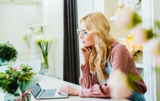 How to prepare for a wedding professional virtual assistant; woman working at laptop